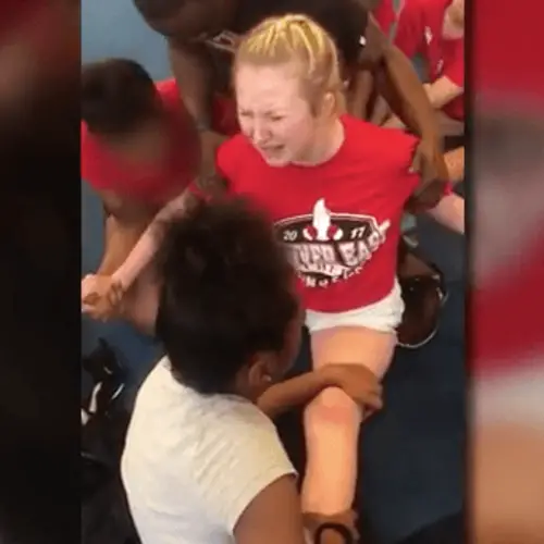 Disturbing Videos Show Cheerleaders Being Forced Into Painful Splits By Coach