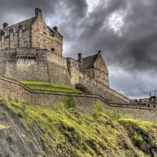 The Story Of Edinburgh Castle, The Scottish Fortress That's Stood Since The Middle Ages