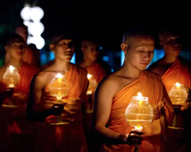 Buddhist Monks Hold Light
