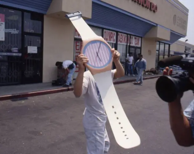 Man Holds Gigantic Watch In Parking Lot
