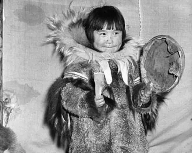 Inuit Girl Playing A Drum