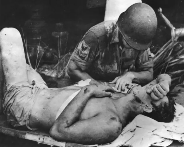 American Soldier Calms Injured Comrade At Guadalcanal