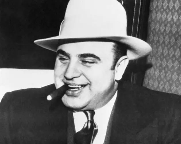 Al Capone Chomping On A Cigar And Smiling