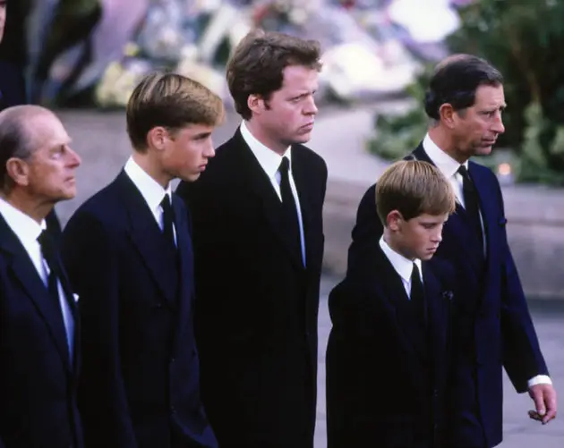 Four Suited Men Walk Somberly