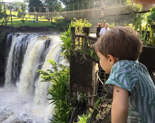 Kid Overlooking Waterfall