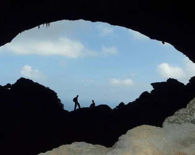 Silhouettes In Cave