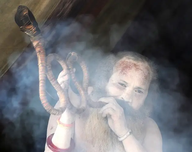 Man Smoking Long Pipe