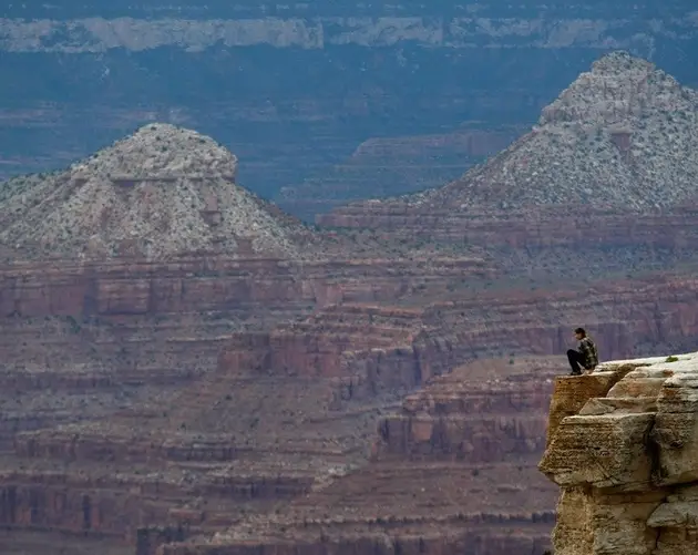 Sitting On Cliff