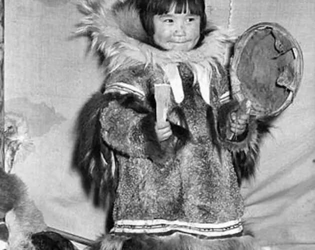 Inuit Girl Playing A Drum