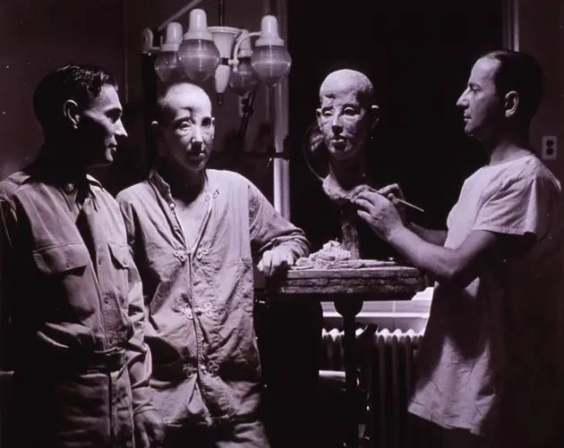 Posing With Plaster Mask