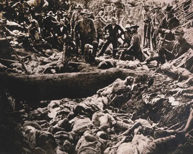American Soldiers Inspect Insurgent Casualties