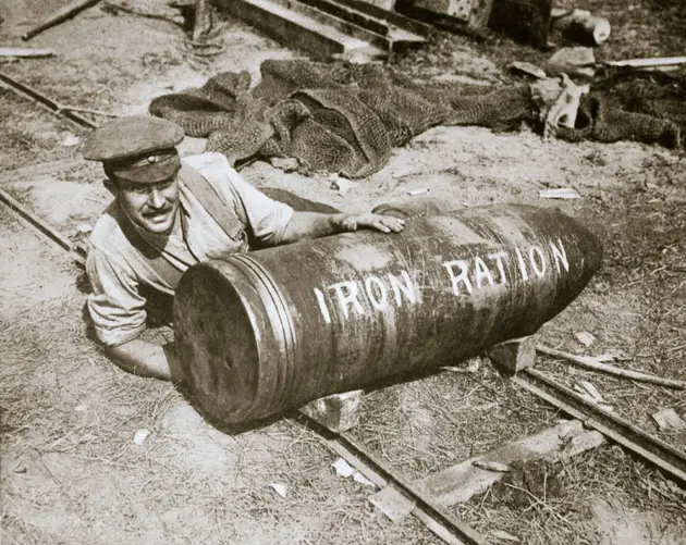 Man Spoons Ammunition Shell