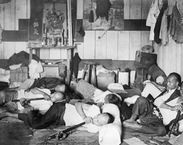 People Relaxing In New York Opium Den