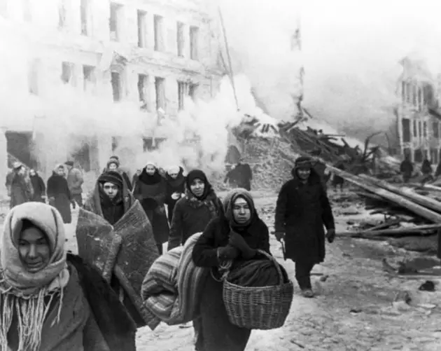 Civilians Abandon Building Being Bombed