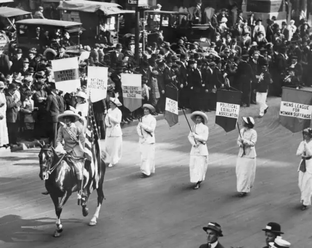 Four Women In White With Flags Lead Giant Procession