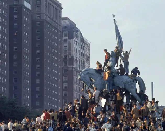 Demonstrators On Statue In Grant Park