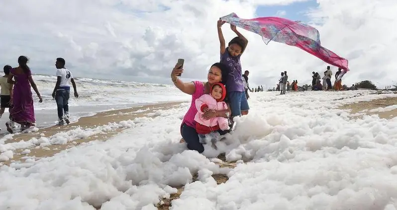 Toxic Foam Washes Up On Indian Beach — And People Keep Taking Selfies In It