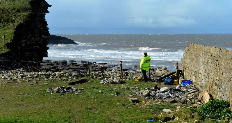 Castle Wall Collapse Reveals Human Remains On The Coast Of Wales — And They Could Be Centuries Old