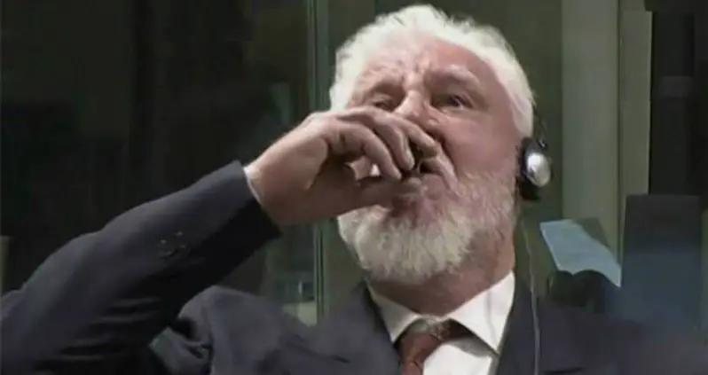 War Criminal Drinks Poison And Dies After Being Ruled Guilty [VIDEO]
