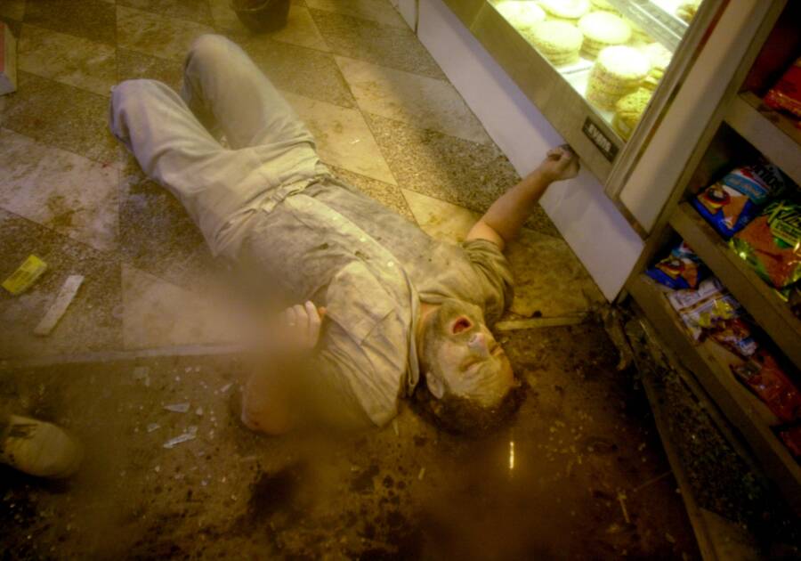 Ash Covered Man Lies Down In Deli