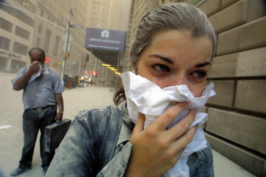 Ash Covered Woman Covers Her Face