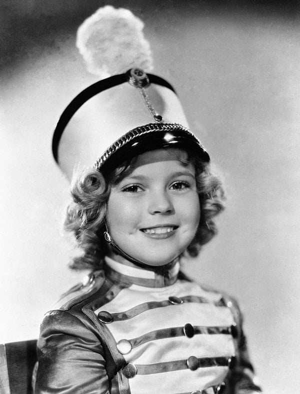 Child Actress Wearing Conductor's Hat