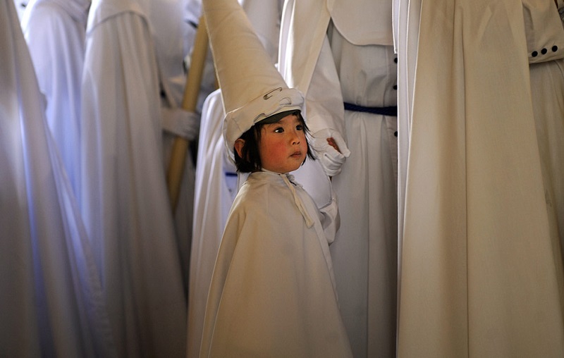 Child Partakes in Holy Week