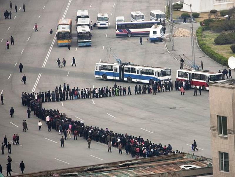 North Korea Photographs Line For Buses In North Korea