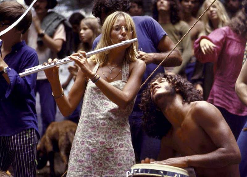 Hippie Woman Playing The Flute