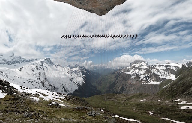 Climbers suspended from cliff on the Matterhorn.