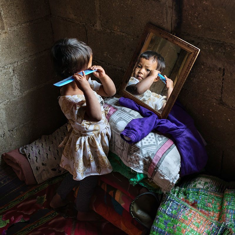 Khasi Girl-Child Brushes Hair