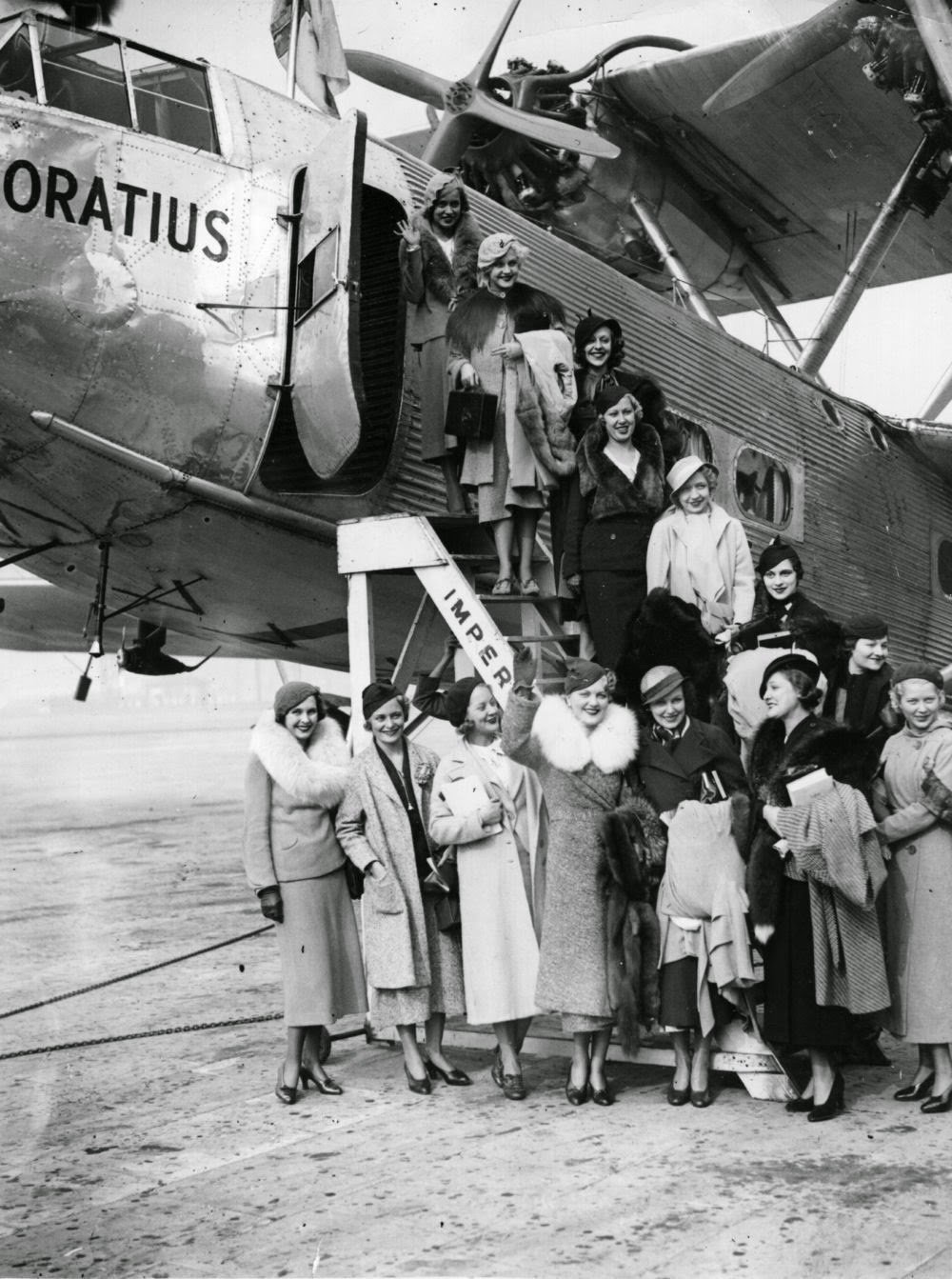 Ladies in fur boarding airplane