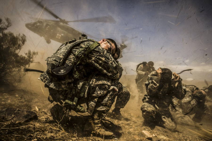 Landing Helicopter Crouching Soldiers