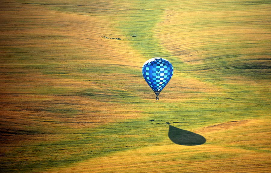A hot-air balloon flies over the outskirts of Minsk, Belarus as part of the Second Annual Aeronautics Championship. Source: The Atlantic