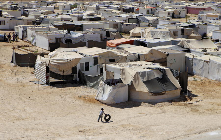Refugee Camp Boy Tire