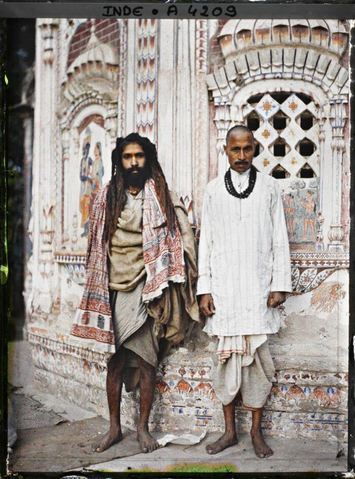 Men In Front Of A Hindu Temple