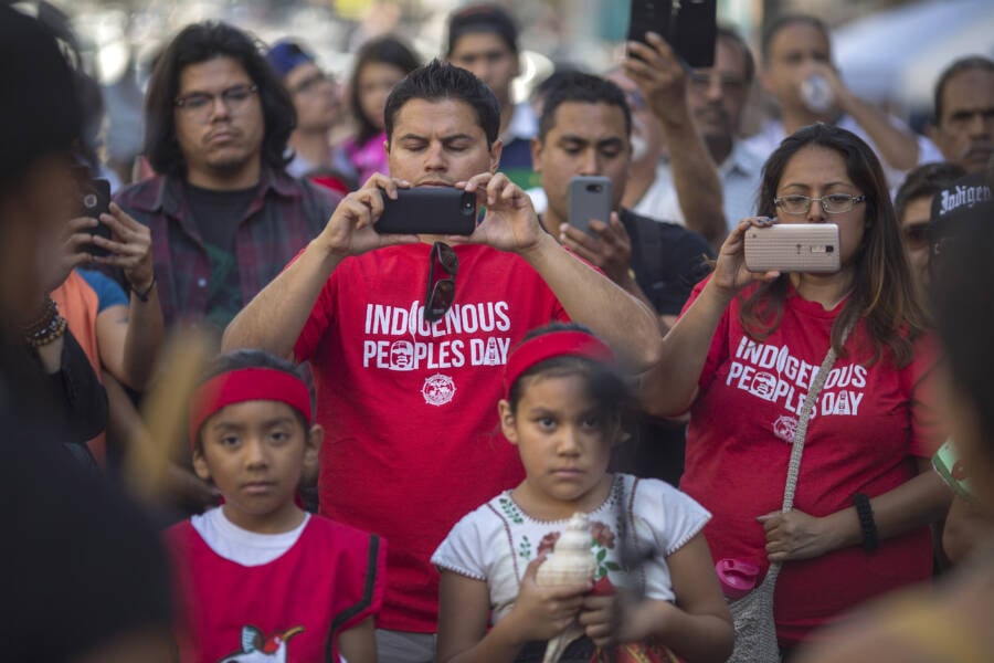People In Crowd With Indigenous Peoples Day Shirts
