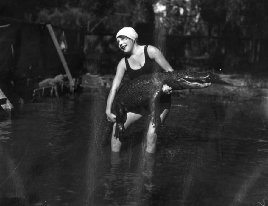 Woman Holding Alligator