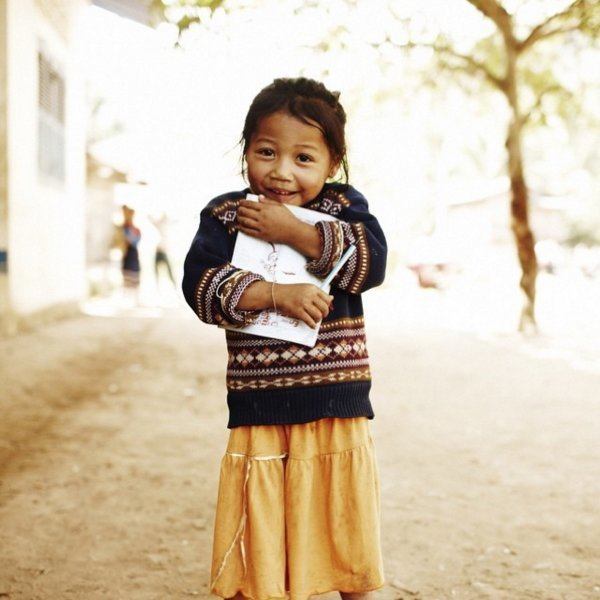 Little Girl Clutching Book