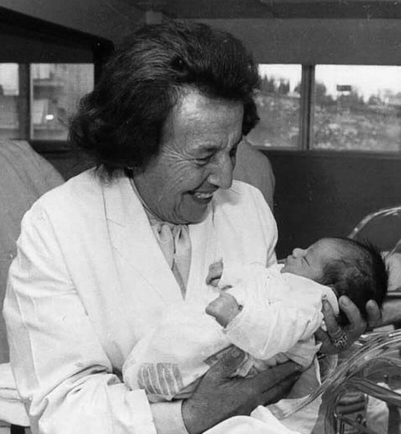 Gisella Perl Holding A Baby