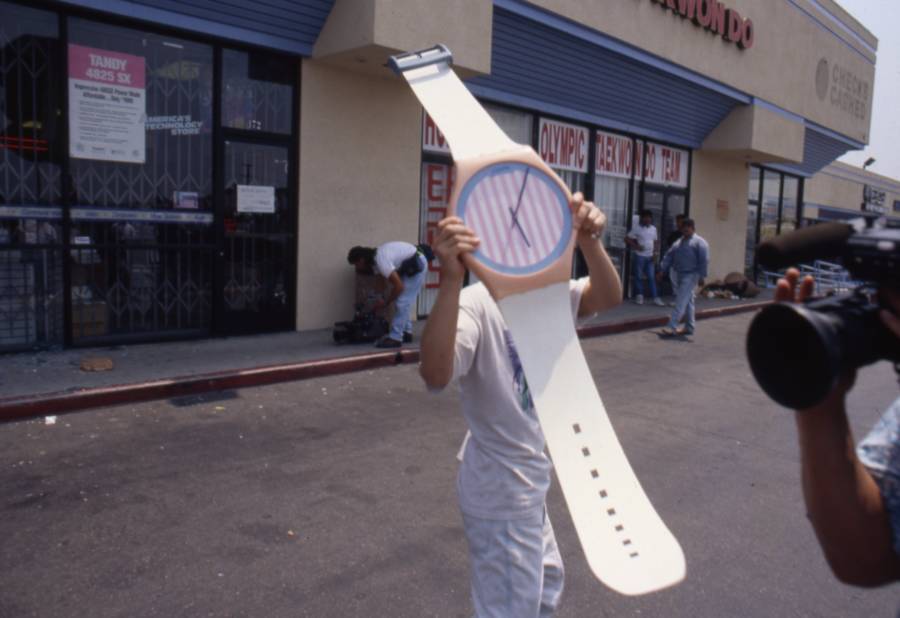 Man Holds Gigantic Watch In Parking Lot