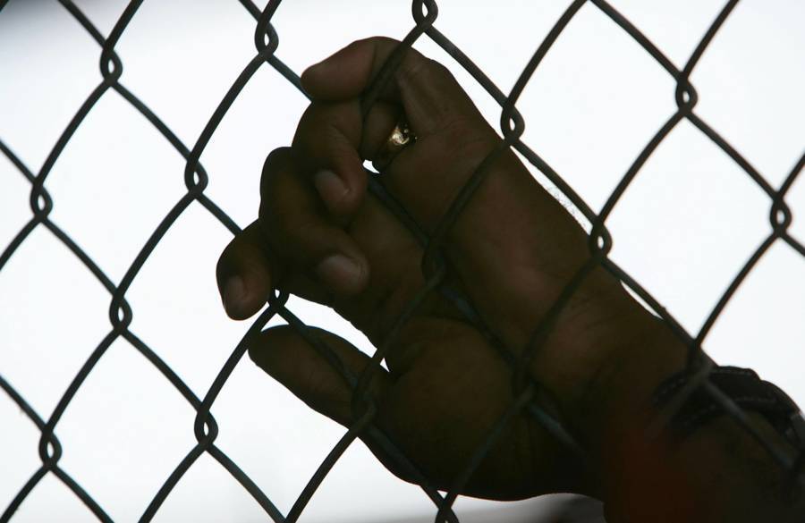 Prisoner's Hand On Fence At Angola Prison