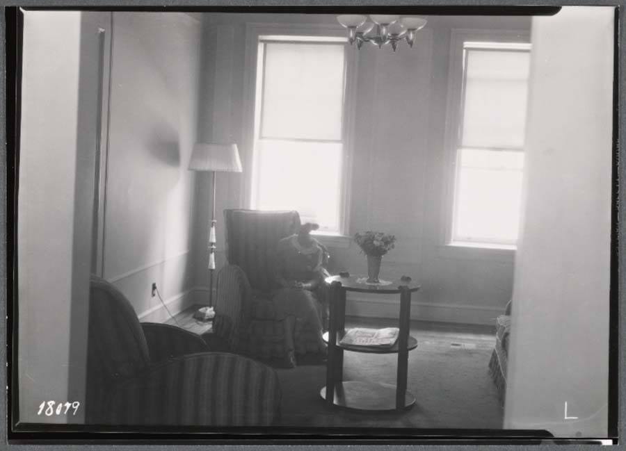 Woman In Living Room Tenement Building