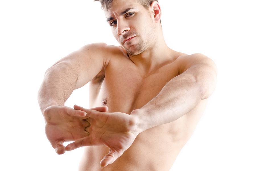 Shirtless Man Cracking Knuckles