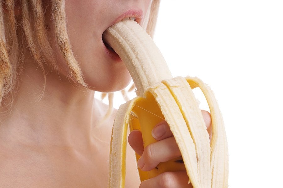 Woman Eating Banana