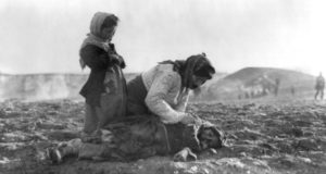 Mother Kneeling On Ground