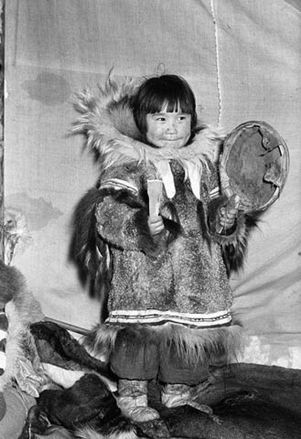 Inuit Girl Playing A Drum