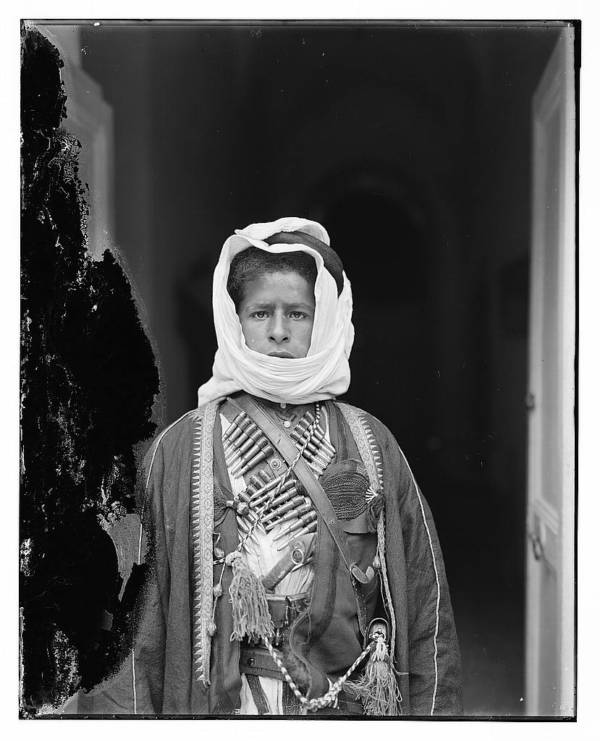 Bedouin Boy With Cartridges