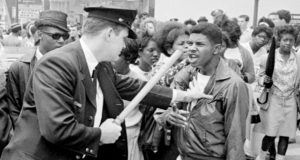 Cop And Young Protester