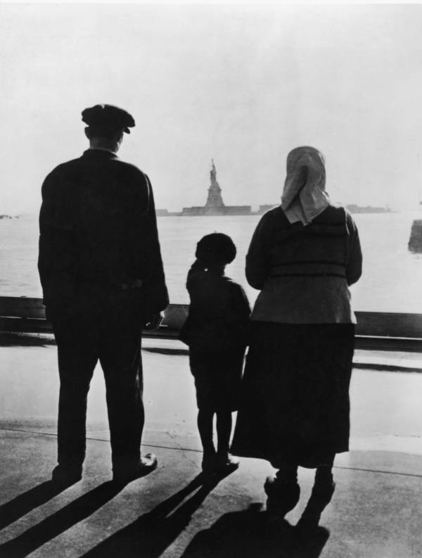 Ellis Island Immigrants Look At The Statue Of Liberty